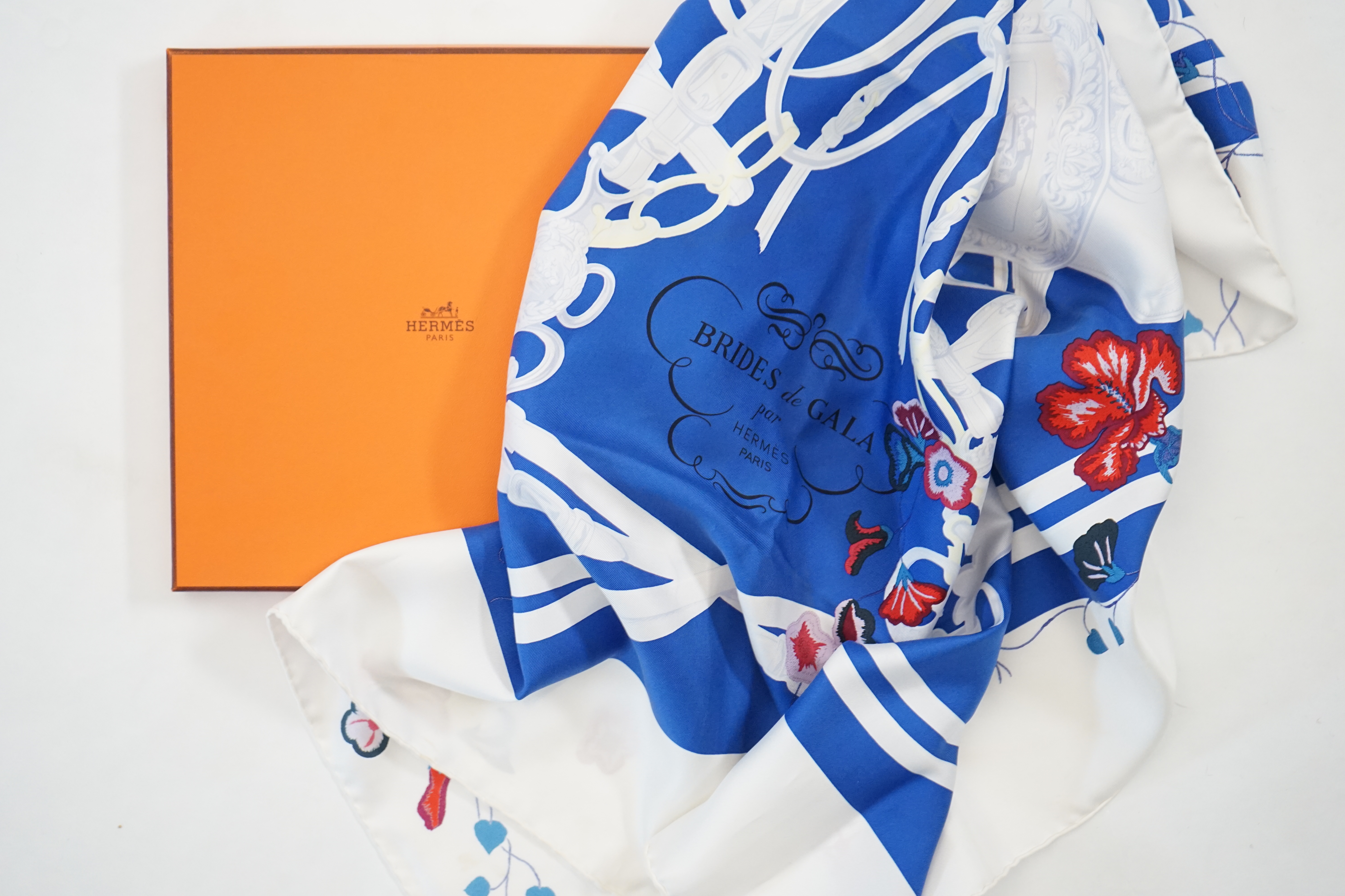 A white Hermès Brides de Gala silk scarf, approx 89cm x 88cm